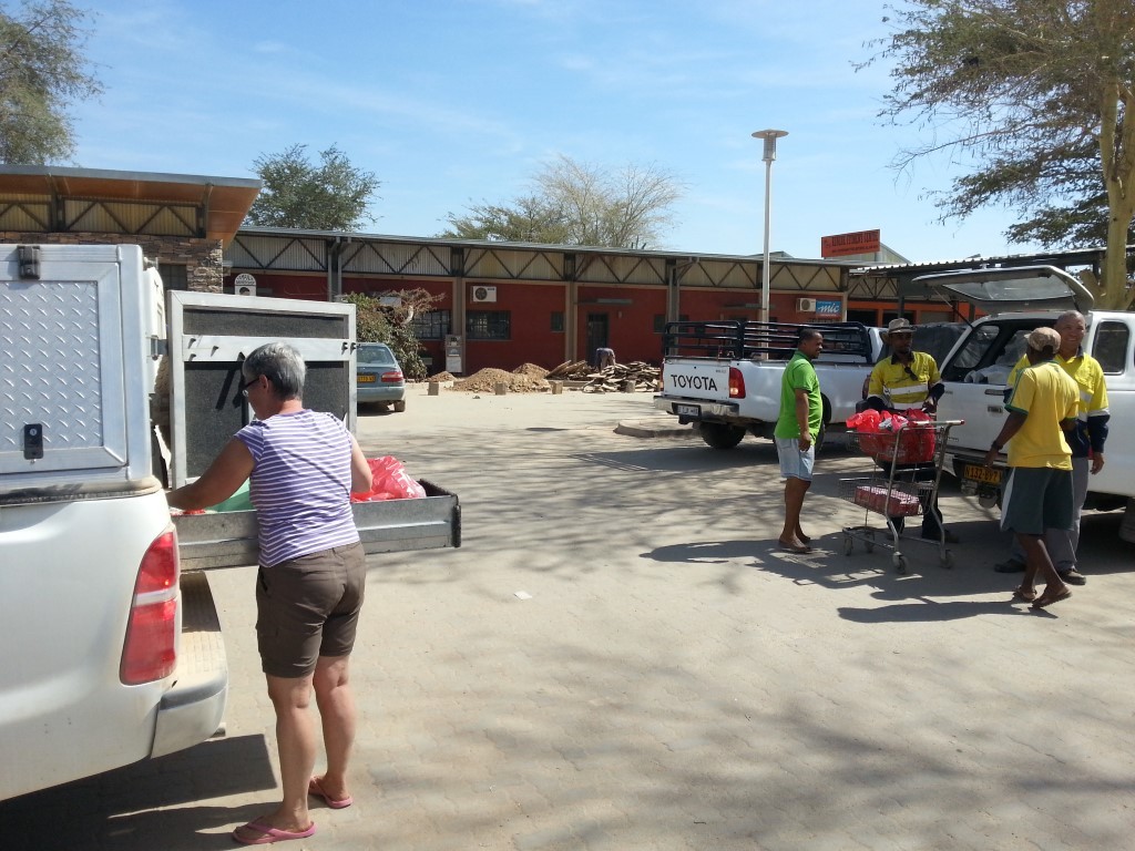 The craziness that was the OK supermarket at Opuwo - loading groceries.